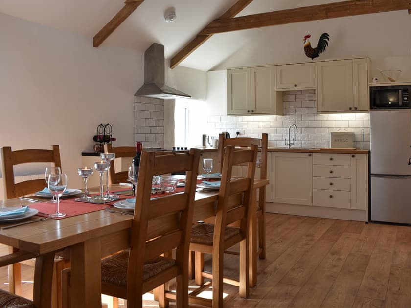 Dining area and adjacent kitchen | Bull Pen - Morwenna Barns, Mount Hawke, near St Agnes
