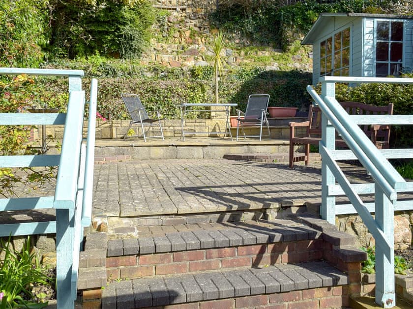 Enclosed terraced courtyard with garden furniture | Yorke Villa, Fishguard
