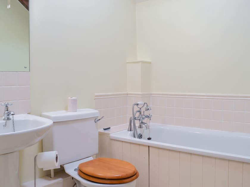 Bathroom with shower over the bath | Tregella Farm Cottage, Near Padstow
