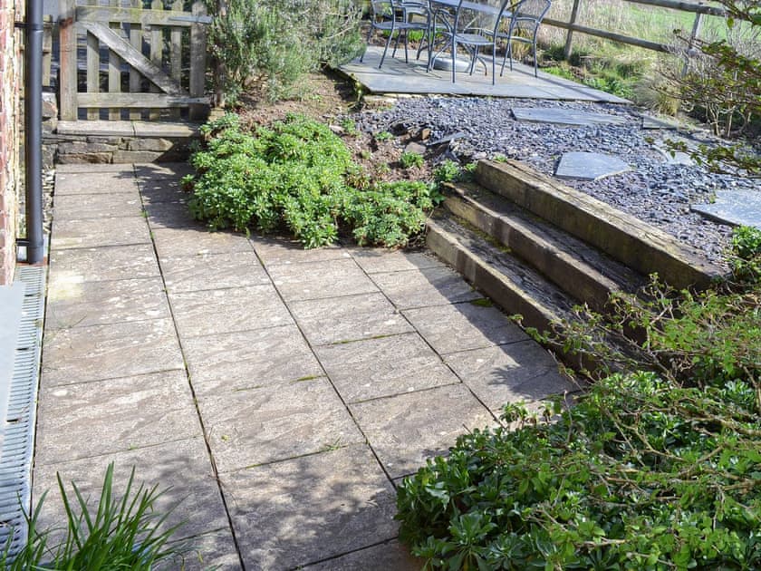 Flagged patio with railway sleeper steps | Tregella Farm Cottage, Near Padstow