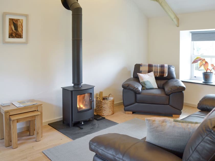 Warming wood burner within living area | Number 19, Trewellard, near St Just
