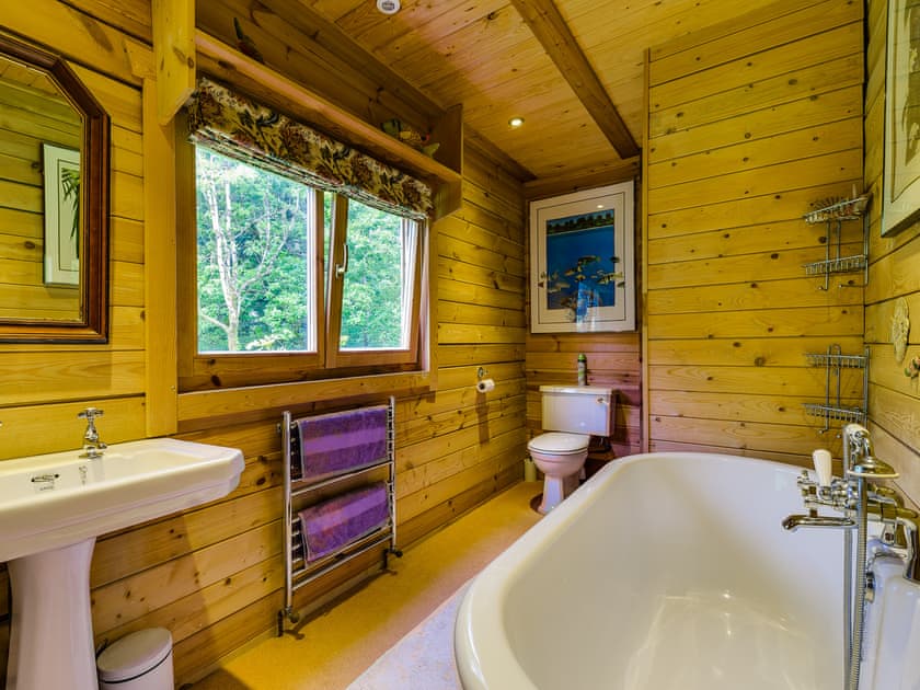 Characterful bathroom with double ended roll top bath  | Ash Mill Cabin, Ashreigney, near Chulmleigh
