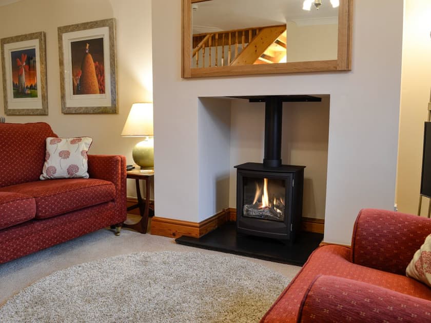 Living room with wood burner | Rose Cottage, Betws-y-Coed