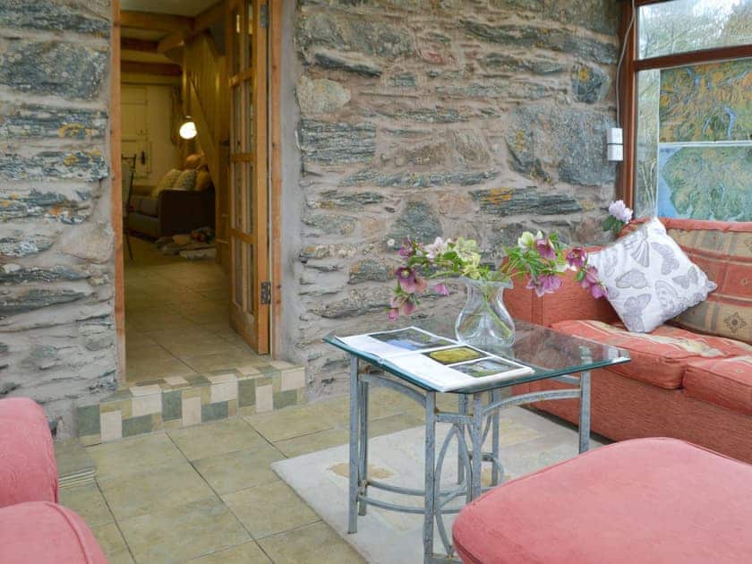 Comfortable furnishings within the conservatory | St Francis Cottage, Ulpha, near Broughton-in-Furness