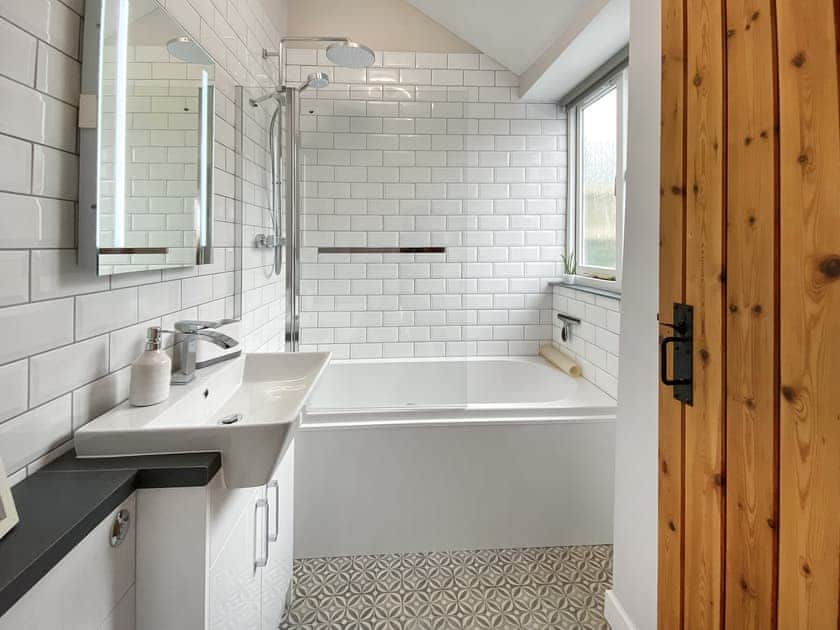 Bathroom with shower over the bath | Wild Rose - Treligga Farm Cottages, Treligga, near Port Isaac