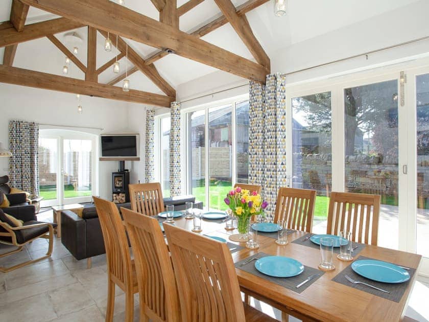 Open-plan living space with exposed wood beams | The Cartshed, Slindon, near Eccleshall