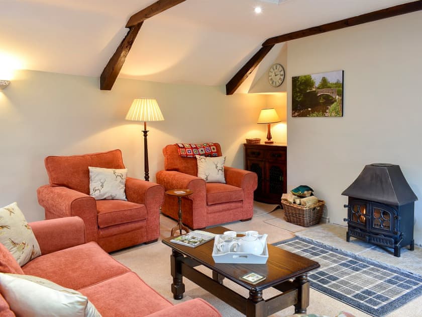 Comfortable living area with a gorgeous wood burner  | 2 Swallowholm Cottages, Arkengarthdale, near Reeth