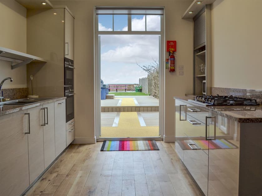 Kitchen leading out into the garden | Twin Bays House, Scarborough