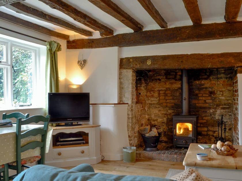 Characterful living/ dining room with cosy wood burner | Three Ash Cottage, Bungay