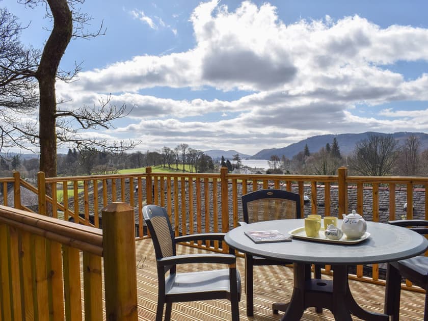 Admire the wonderful view of Lake Windermere from the decking | Woodside Cottage, Ecclerigg, near Ambleside