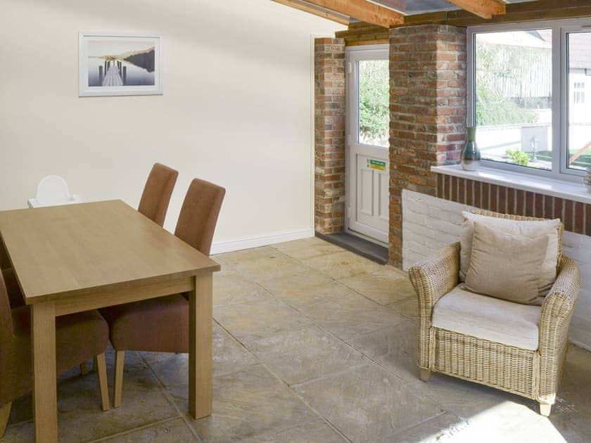 Spacious sun room with dining area | Barley Mill - Peigh Hills Farm, Tritlington, near Morpeth