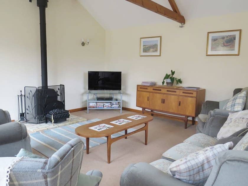 Spacious beamed living room | The Stables, Thrigby, Great Yarmouth