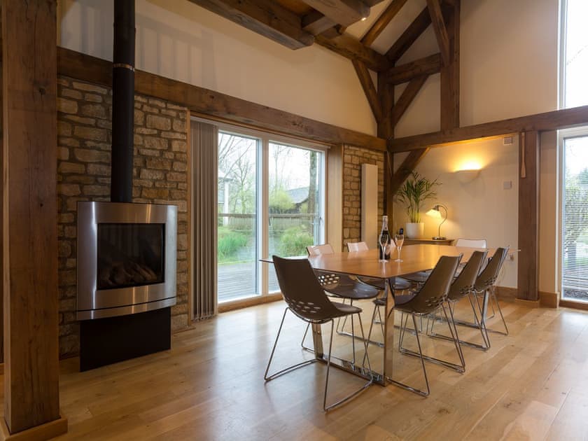 Dining area with wood burner | Coot Lodge, Somerford Keynes, near Cirencester