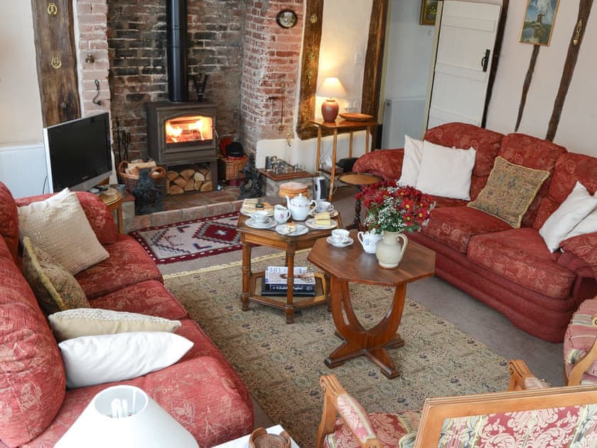 Cosy living room with wood burner | Star Cottage, Eye
