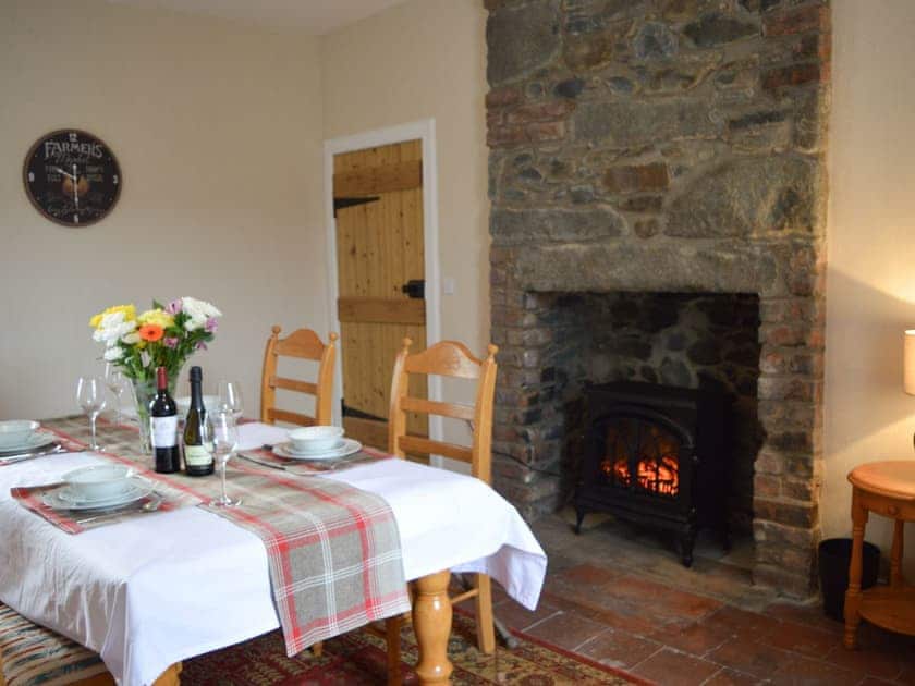 Dining room with wood burner | The Dairy House, Near Newton Stewart