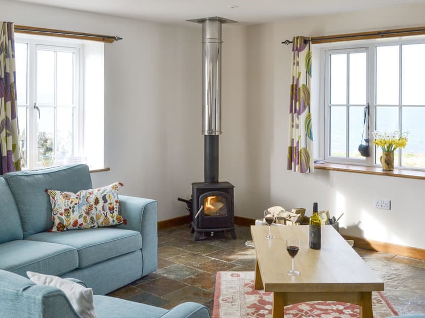 Welcoming living area with wood burner | The Old Dye House, Hallin