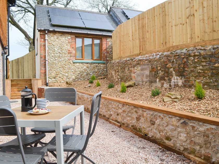 Delightful gravelled area with table and chairs | The Wheel House, East Hill, near Ottery St Mary