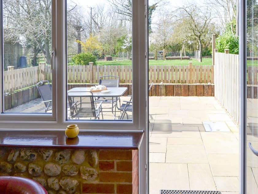 Access from living area to the enclosed paved patio area | The Granary - White House Farm Holiday Cottages, Knapton, near North Walsham
