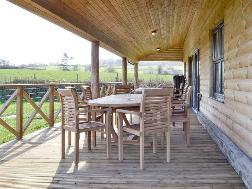 Decked area with outdoor furniture and hot tub | Lakeside Lodge, near Rhayader