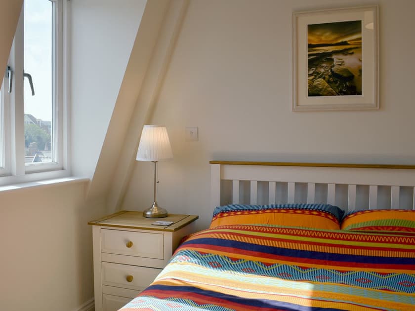 Comfortable double bedroom | Sandcastles, Swanage
