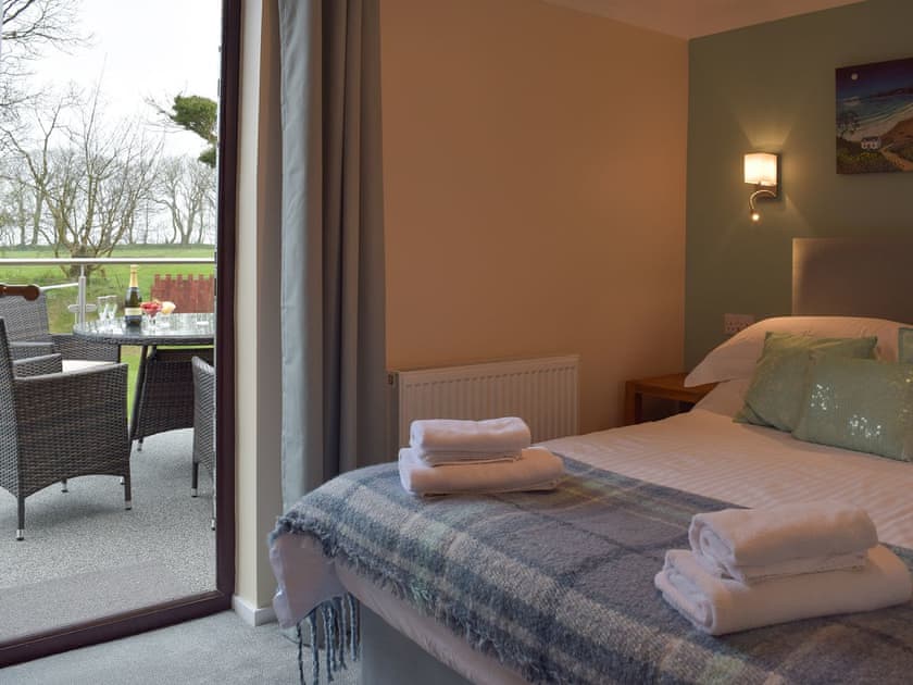 Double bedroom with balcony  | The Old Coach House - Hayscastle Cottages, Hayscastle