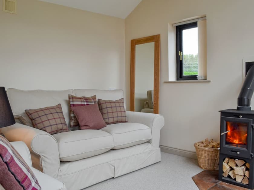 Charming living room with wood burner | End Cottage, Tibthorpe, near Driffield 