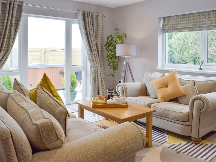 Delightful living area with access to patio and hot tub | Oak Cottage - Firstone Holiday Cottages, Walwyns Castle, near Broad Haven
