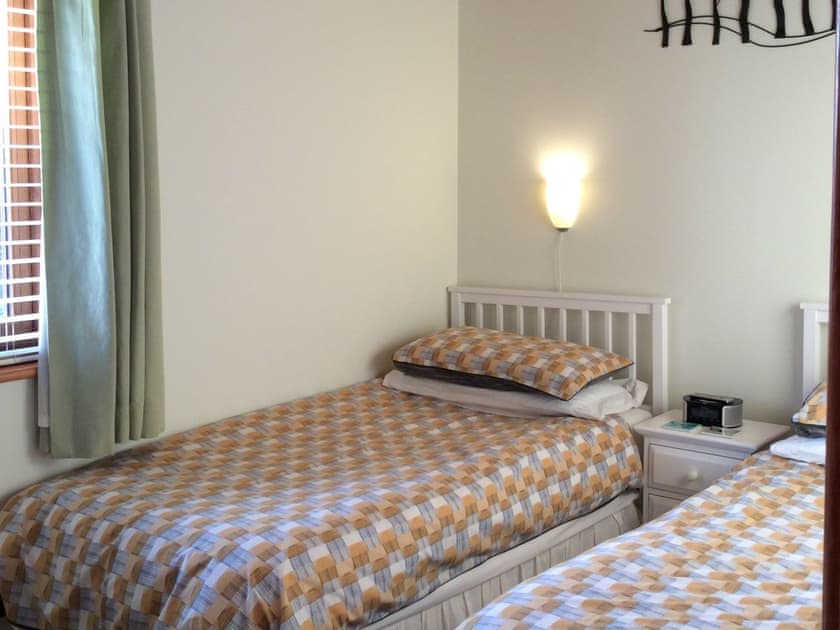 Comfortable twin bedroom | Larchwood, Dukes Meadow, near Greystoke