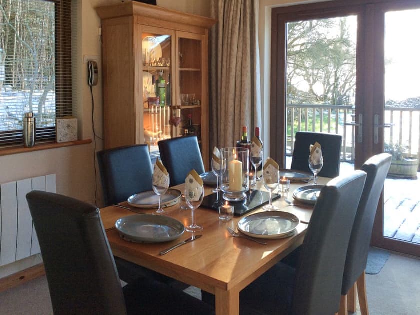 Dining area with access to the decking | Larchwood, Dukes Meadow, near Greystoke