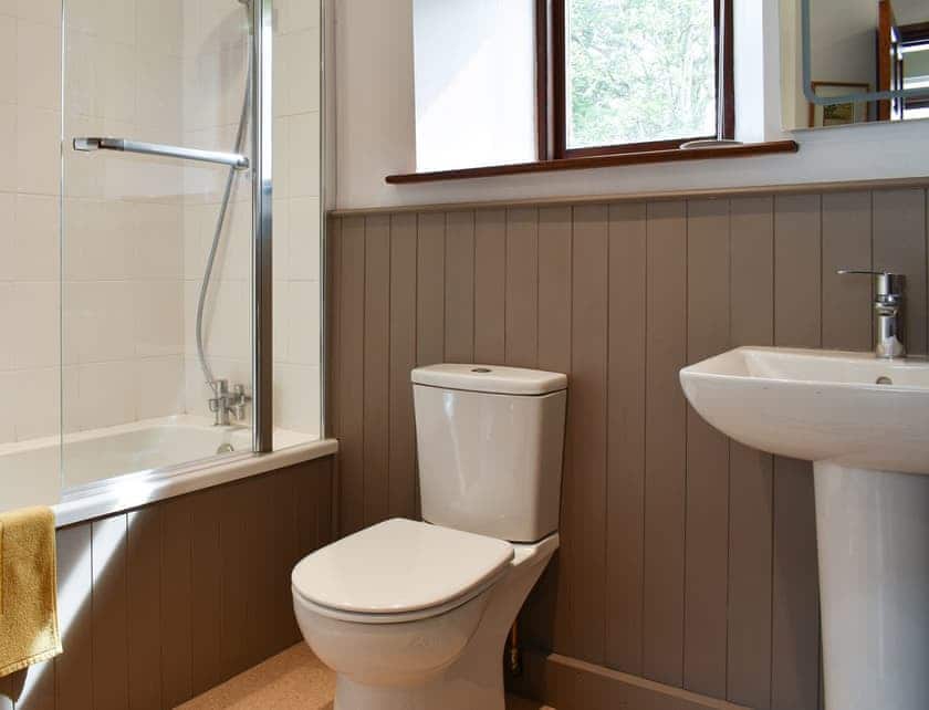 Bathroom with shower over bath | Yew Tree Farm, Low Newton