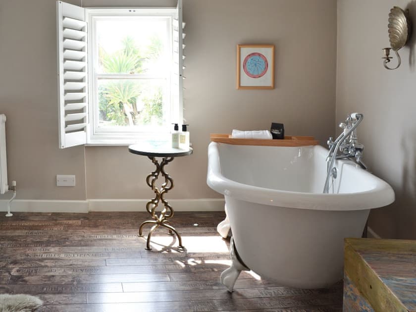 Free-standing bath within the double bedroom | The Old Stores, Mousehole, near Penzance
