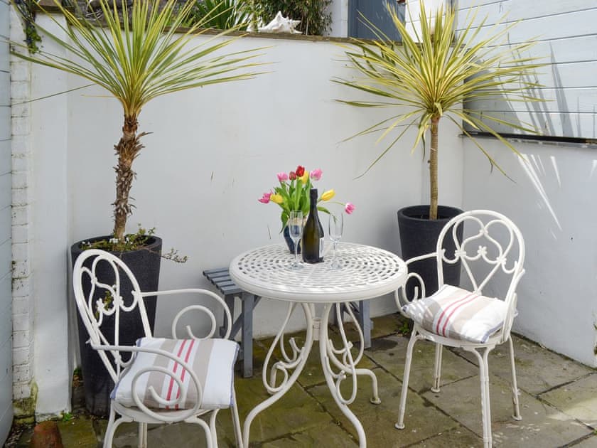 Patio area with outdoor furniture | The Old Stores, Mousehole, near Penzance