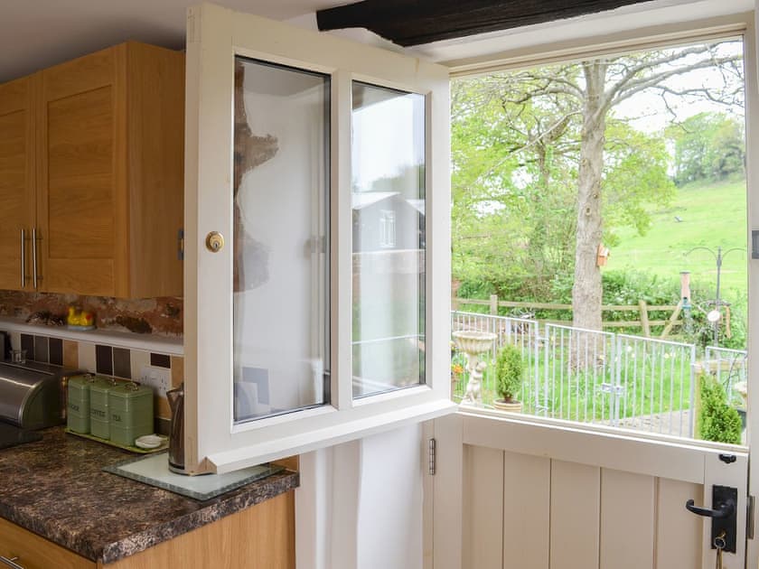 Wonderful view over the patio from the kitchen stable door | Fair Maid - Glimsters Farm Holiday let, Kentisbeare, Cullompton