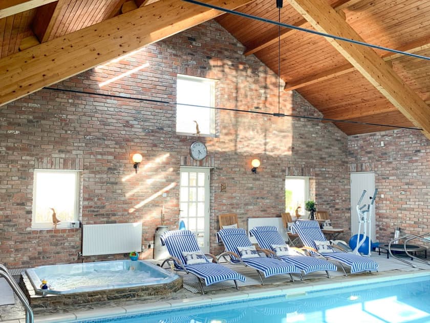Swimming pool area can be booked at small extra cost | Eider Cottage, Holmfirth