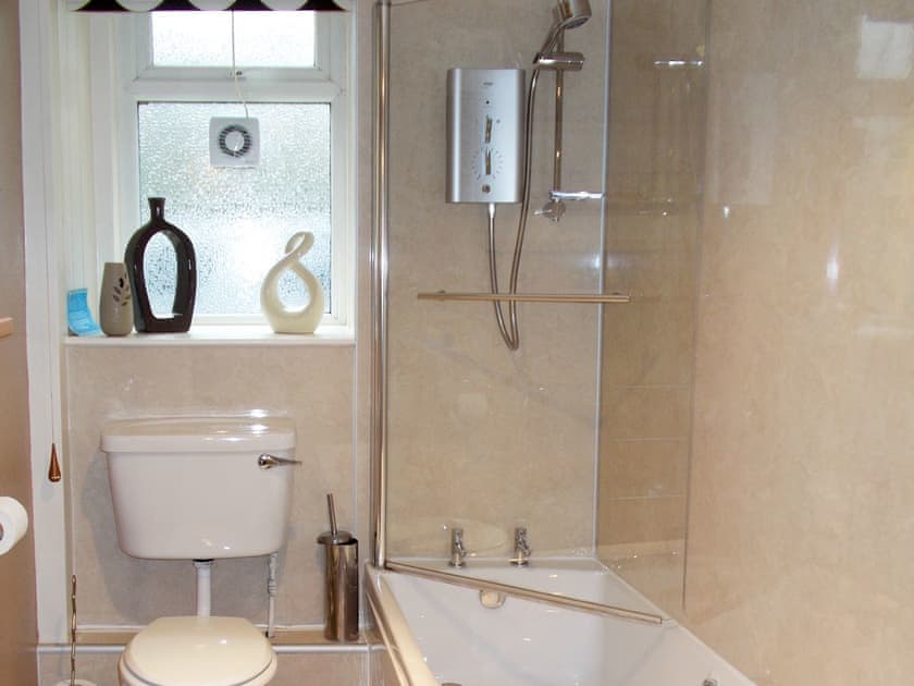 Family bathroom with shower over bath | Blaeberry Cottage, Near Lockerbie
