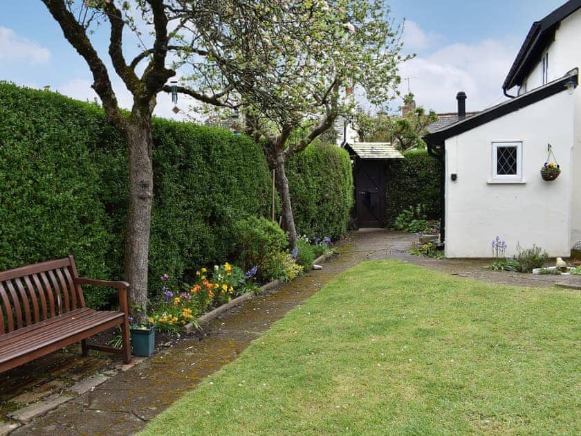 Delightful garden with bench seating | Apple Tree Cottage, Charmouth