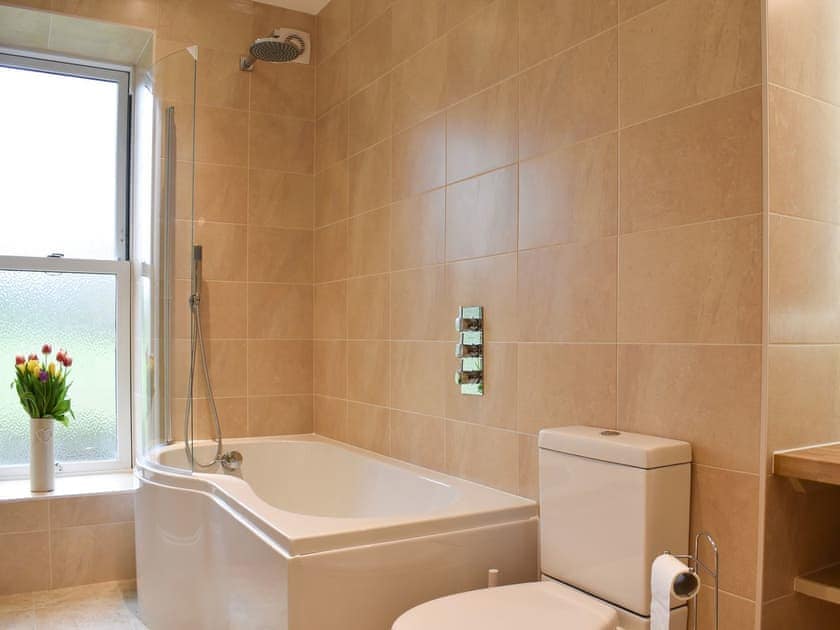 Bathroom with shower over the bath | Burton House - Reeth Holiday Cottages, Reeth, near Richmond