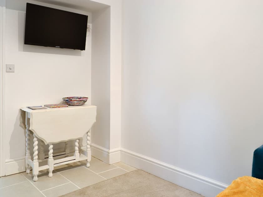 Wall mounted TV within the living and dining room | Brig-y-Don Bach - Brig-y-Don, Llanaber, near Barmouth
