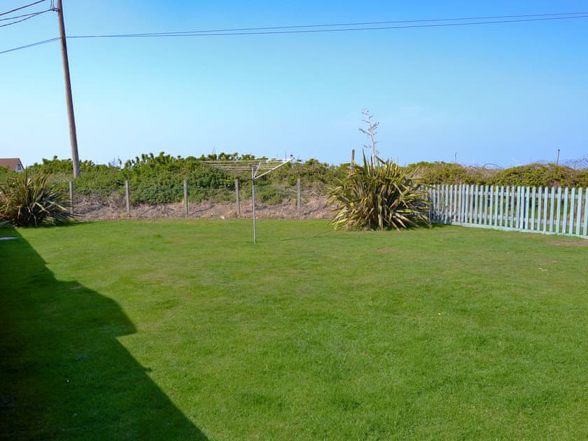 Large lawned garden | Cottage By The Sea, Bacton, near North Walsham