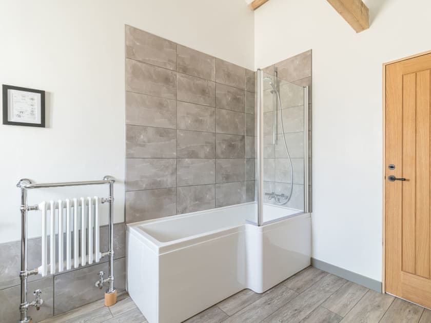 Shower over bath within family bathroom | Grange Cottage, Harome, near Helmsley