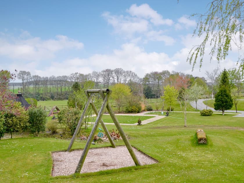 Extensive gardens and swing | Kinnelhook Holiday Cottage, Lochmaben, near Lockerbie