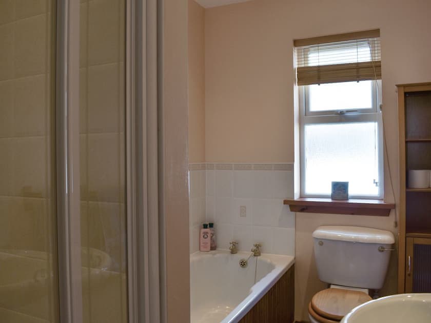 Bathroom with bath and shower cubicle | Seashore Retreat, Johnshaven, near Montrose