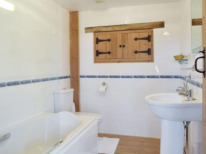 Bathroom with shower over bath | Hayloft Cottage - Croft Farm Cottages, Ludchurch, near Narberth