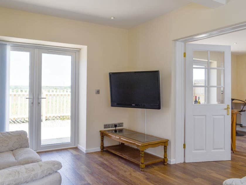 Spacious living area with French doors to patio area | Stars Cottage, Moreton, near Wareham