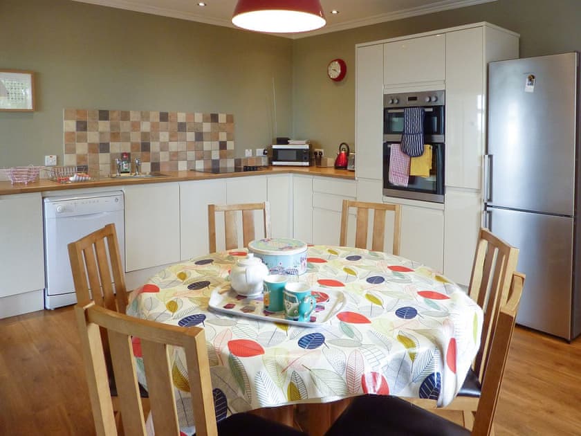 Convenient dining area within kitchen | Kirkbride Farmhouse, Carsluith, near Newton Stewart