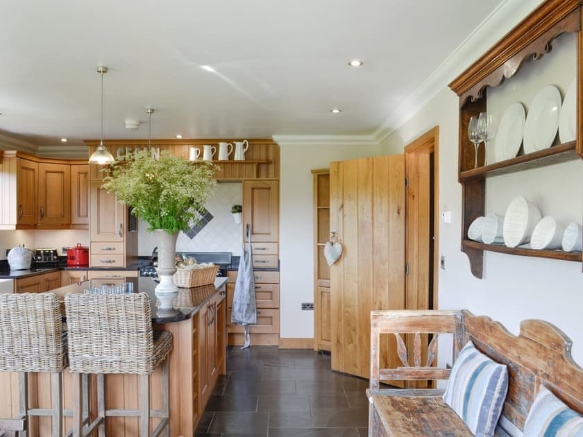 Well-equipped kitchen with useful kitchen ’Island’ | Maes Y Bryn Farmhouse, Llansadwrn, near Llandeilo