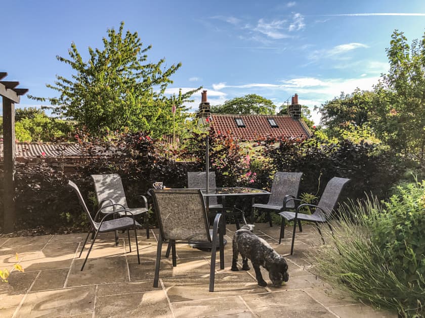 Paved patio area with seating | Rose Cottage, Fylingthorpe, near Whitby
