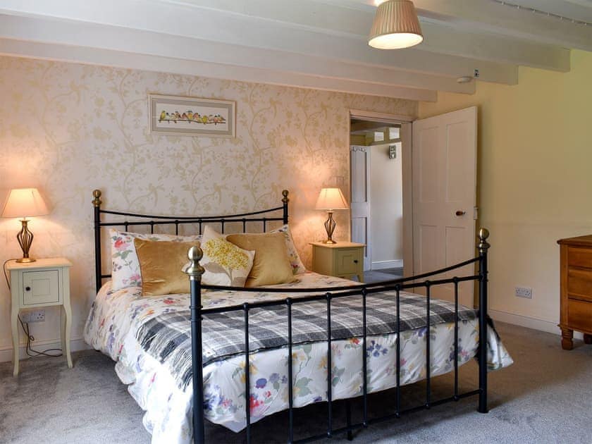 Spacious bedroom with kingsize bed and beams | Tilly’s Cottage, Goathland