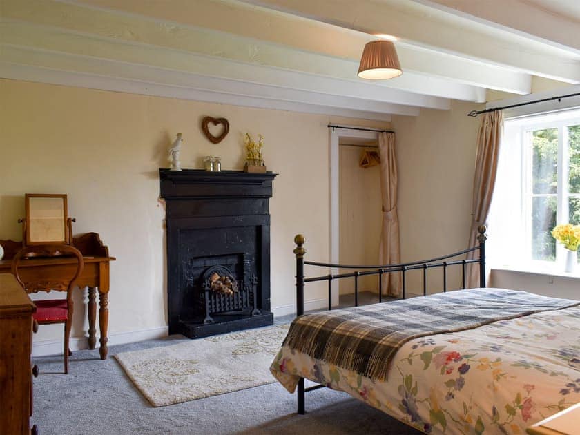 Spacious bedroom with kingsize bed and beams | Tilly’s Cottage, Goathland
