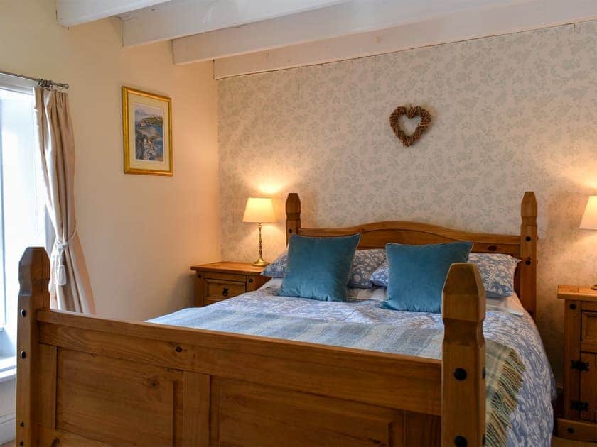 Bedroom with kingsize bed and beams | Tilly’s Cottage, Goathland